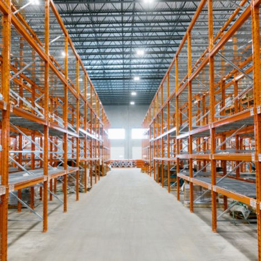 An interior image of the tenant improvement of 60,000 square foot warehouse features heavy industrial manufacturing machinery and tool shop which required a significant base building utility upgrade and independent generator.