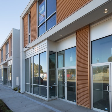 The exterior image of the completed 8-unit warehouse in North Vancouver, with small office/retail shop frontage, was one of the first new light industrial/commercial buildings. Nick led the design of this project while working at Christopher Bozyk Architects Ltd.