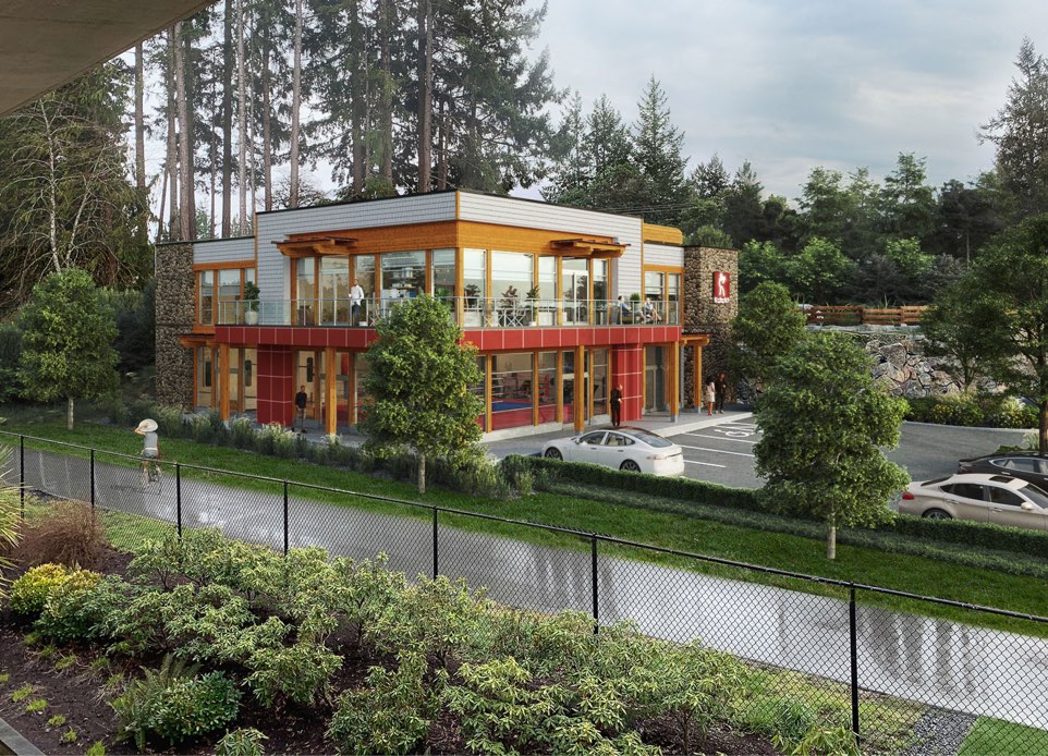 A visualization of 2-storey Boxing Canada’s building with a parking lot surrounded by forest in the City of Langford. Nba architects designed a gym on the ground floor that will be a training centre as well as a showcase for events and offices on the upper floor for the national teams.
