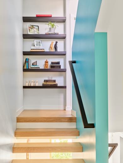 Interior image of a staircase featuring inbuilt shelving.