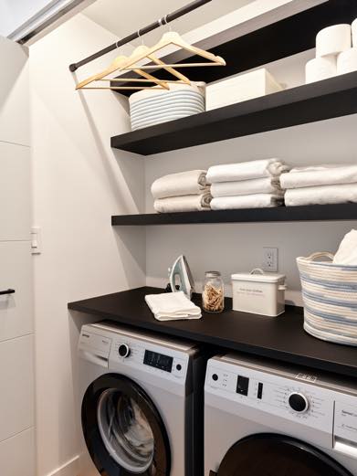 Interior image of laundry room with black millwork.