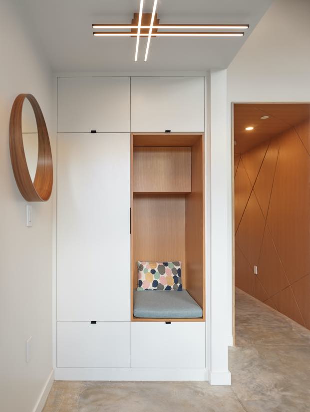 N B A architects designed the cozy seating inside the closet that is a nice interior design element and gives fun space for kids and adults to enjoy reading a book or hide from siblings.
